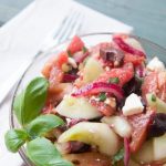 This tangy cucumber tomato salad is packed with flavor and freshness! Kalamata olives, feta cheese, and red onions add interest without stealing the show from the crisp cucumber and juicy tomatoes. | www.pinchmeimeating.com