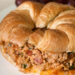 Sun-dried tomato basil chicken salad - There's nothing like the taste of this unique and flavorful chicken salad on a buttery croissant! | pinchmeimeating.com