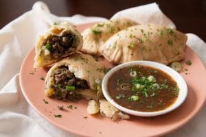 Get a taste of South America with these Argentine beef, potato, and onion empanadas. Serve them with chimichurri! | www.pinchmeimeating.com