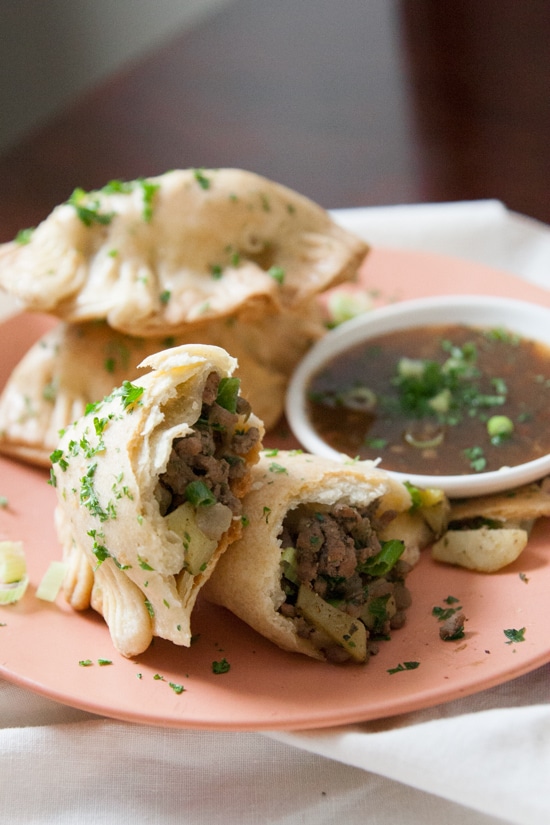 Get a taste of South America with these Argentine beef, potato, and onion empanadas. Serve them with chimichurri! | www.pinchmeimeating.com