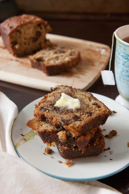 The moistest, meltiest, most delicious chocolate chip banana nut bread you'll ever taste. In the oven in only 20 minutes, and it's great for breakfast AND dessert! | www.pinchmeimeating.com