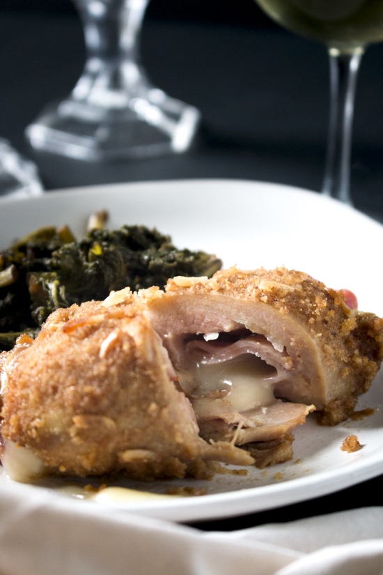 With ham, swiss, and a flavorful breading, this easy chicken cordon bleu is simple enough to make on a weeknight and fancy enough for a romantic Valentine's Day dinner! You can even make ahead of time and bake the day of. It's so juicy and flavorful! | www.pinchmeimeating.com