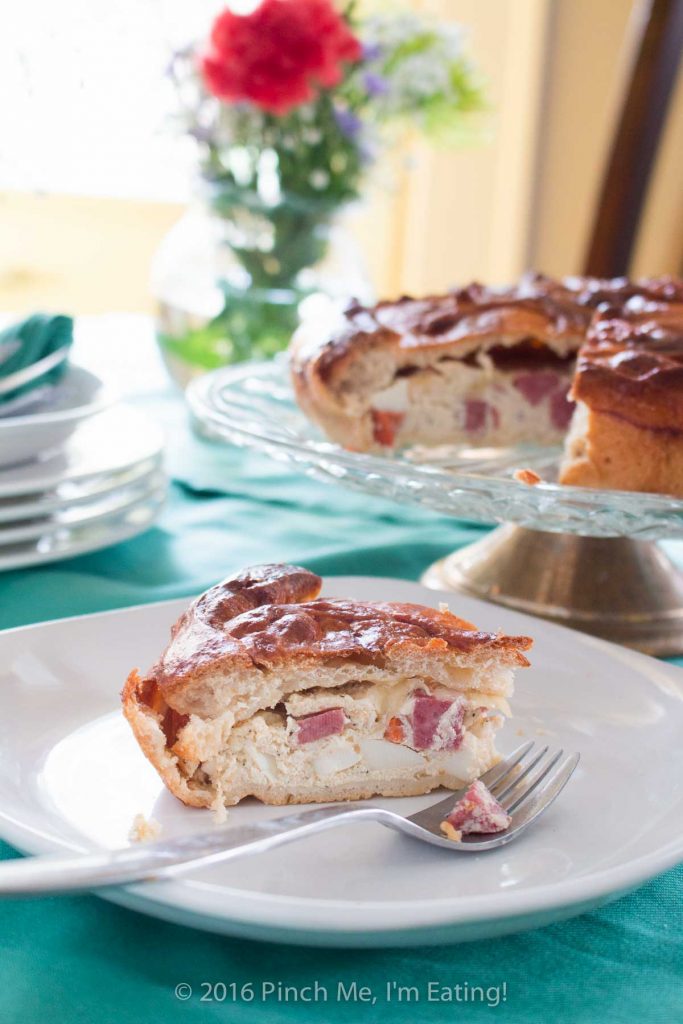 Pizza Rustica, also known as pizzagaina or Italian Easter pie, on a white plate