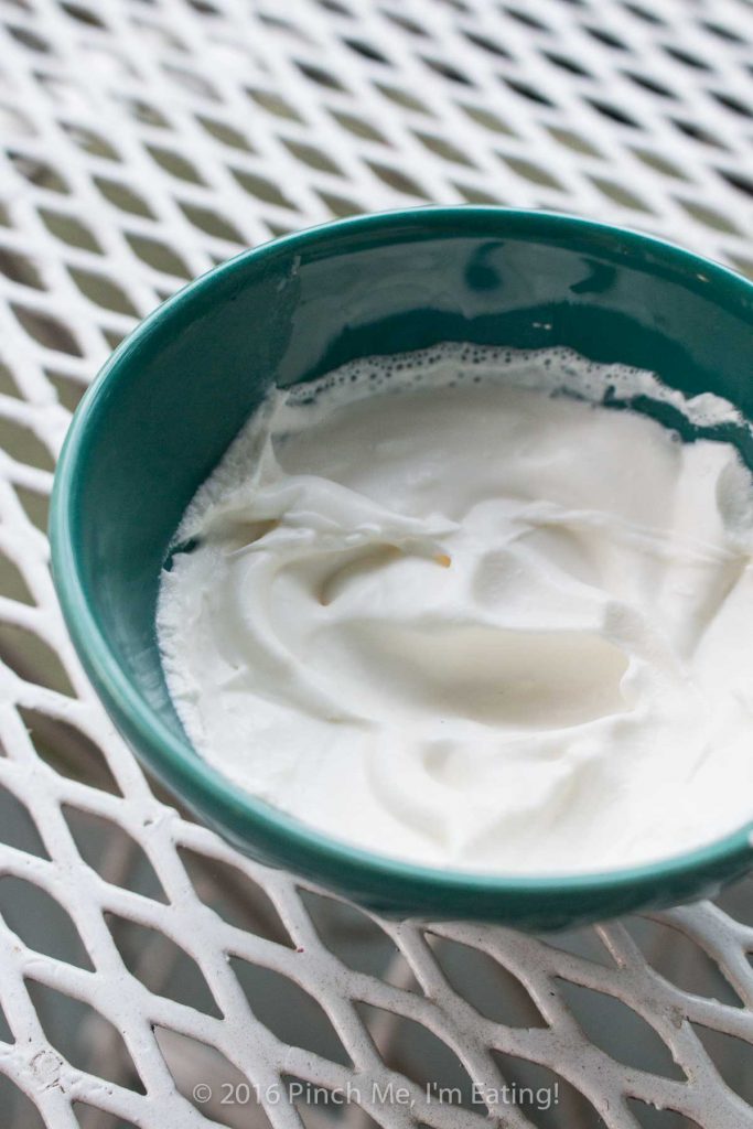 Skip the Cool Whip and the spray can! When all you need is a single serving, make this one-minute one-serving whipped cream with this dangerously easy trick! And there's no heavy kitchen equipment to wash afterwards! You'd never know fresh, homemade whipped cream was this quick or easy. I do this wayyy more often than I should! | www.pinchmeimeating.com