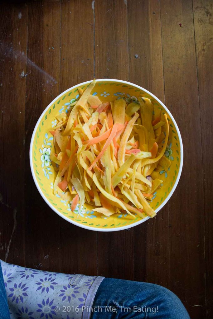 Delicate ribbons of carrots are tossed in browned butter with parsley, sage, rosemary, and thyme and topped with shrimp to make a fresh, flavorful, beautiful, and healthy meal. Carrot noodles are paleo and gluten free too! | www.pinchmeimeating.com