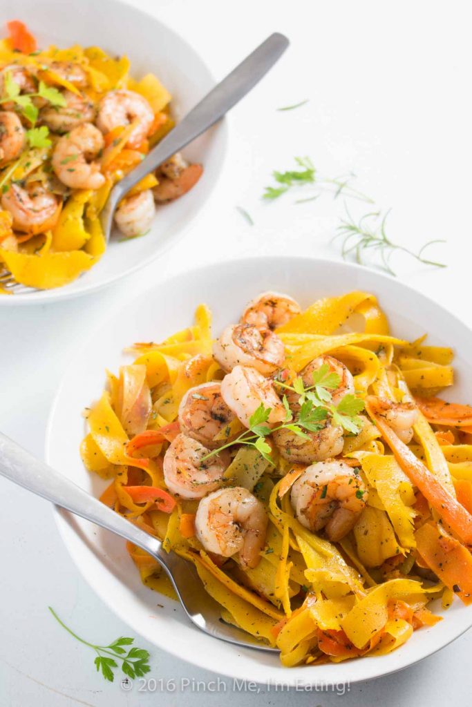 Delicate ribbons of carrots are tossed in browned butter with parsley, sage, rosemary, and thyme and topped with shrimp to make a fresh, flavorful, beautiful, and healthy meal. Paleo and gluten free too! | www.pinchmeimeating.com