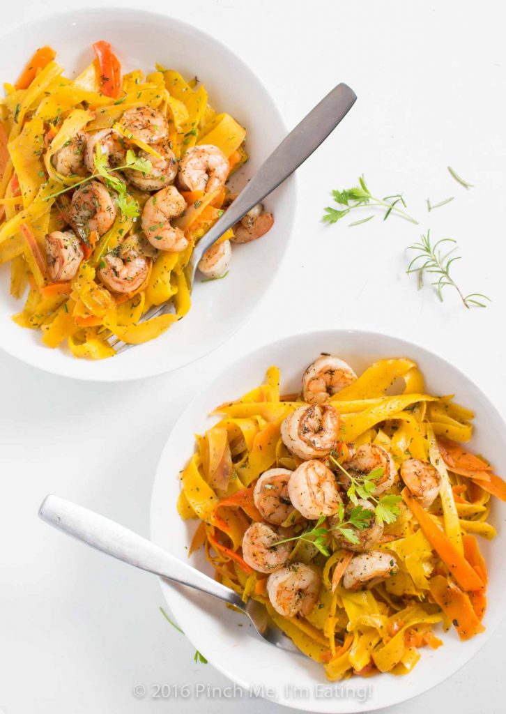 Delicate ribbons of carrots are tossed in browned butter with parsley, sage, rosemary, and thyme and topped with shrimp to make a fresh, flavorful, beautiful, and healthy meal. Carrot noodles are paleo and gluten free too! | www.pinchmeimeating.com