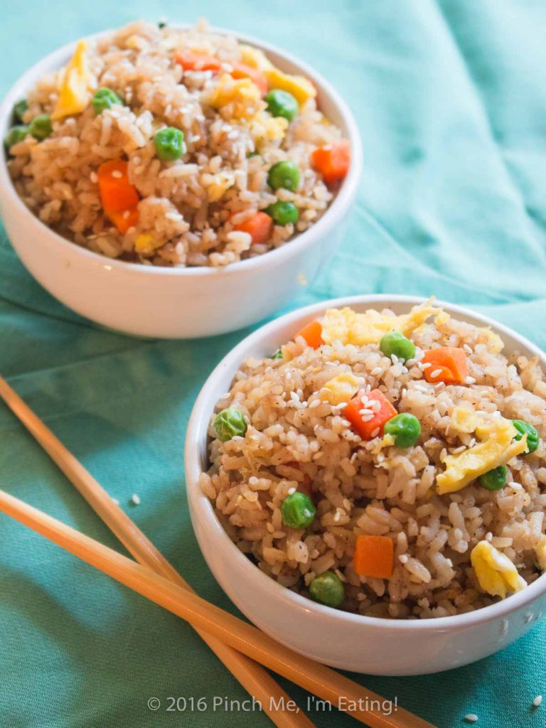Who needs takeout when you can whip up this easy vegetable fried rice at home? All ingredients are easy to keep on hand so you can make some whenever you'd like! | www.pinchmeimeating.com