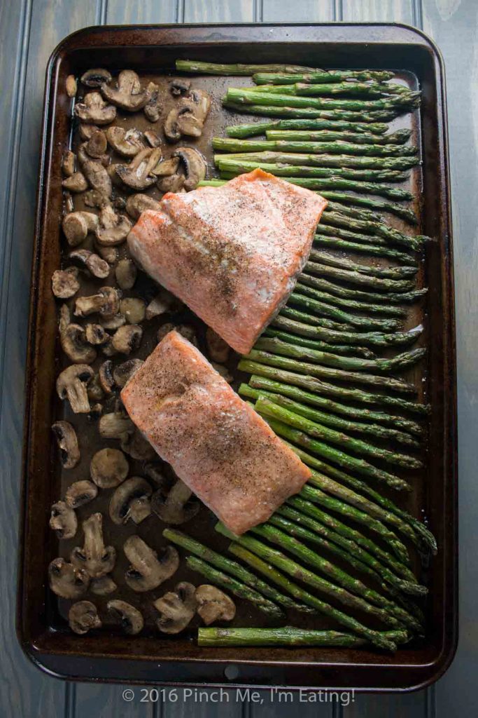 One-pan salmon with asparagus, mushrooms, and balsamic brown butter sauce is the easiest, most delicious dinner - and it's ready in only 20 minutes! This is my new favorite meal! | www.pinchmeimeating.com