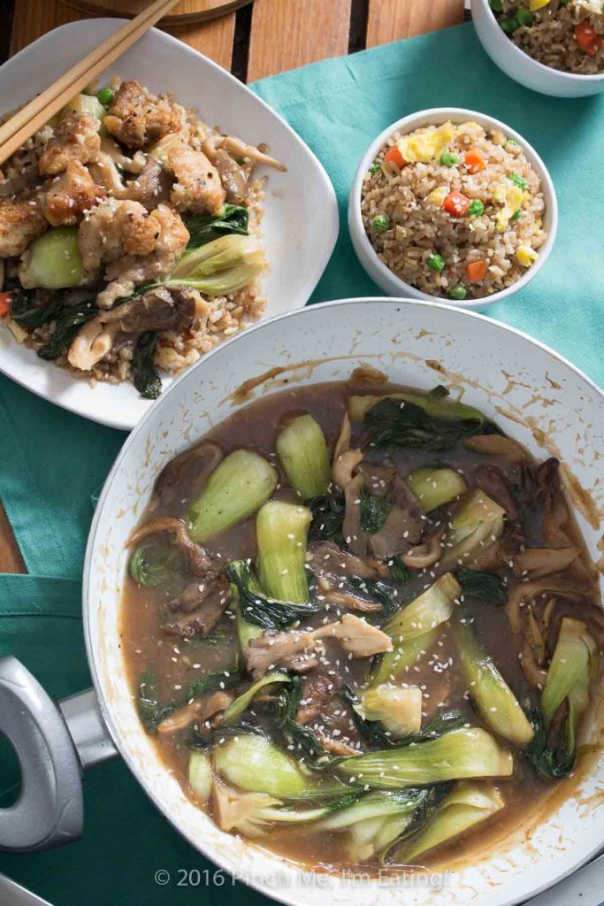 The quickest shallow-fried chicken bites served with adorable baby bok choy and oyster mushrooms in a brothy ginger-garlic sauce. So delicious! It's great with fried rice! | www.pinchmeimeating.com