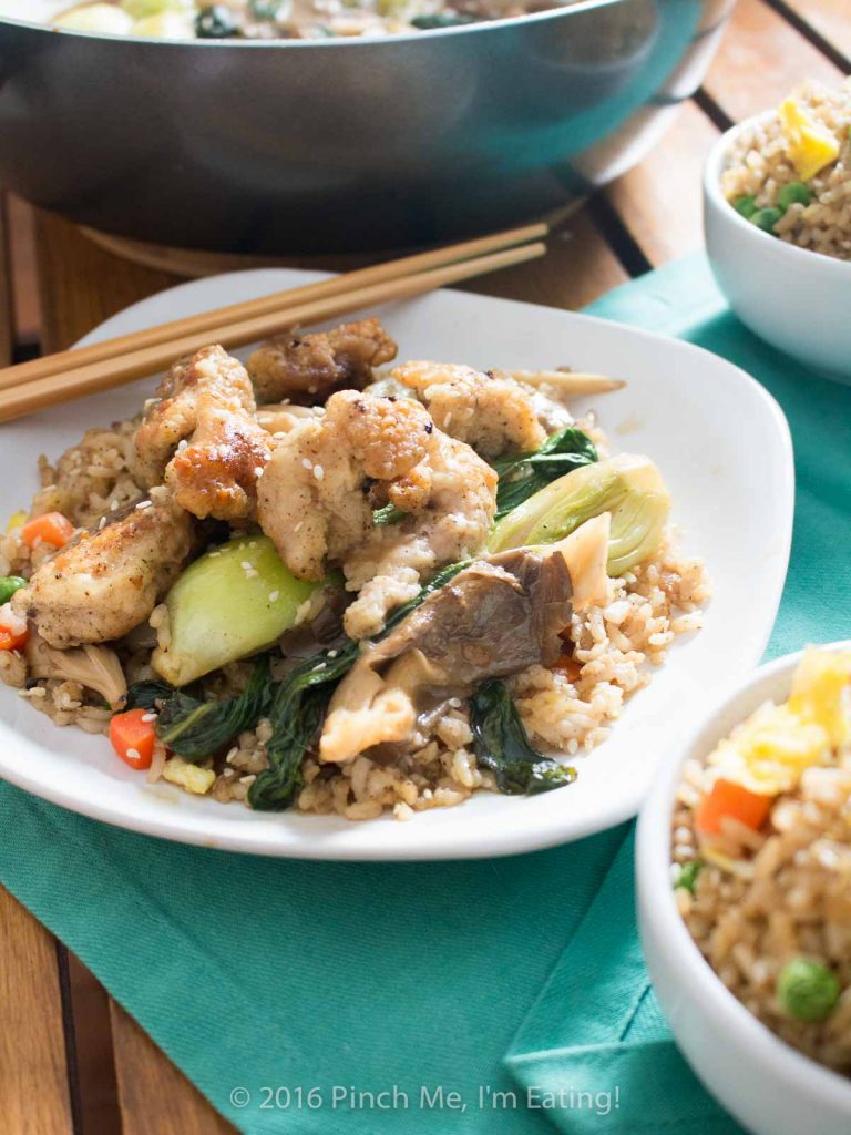 The quickest shallow-fried chicken bites served with adorable baby bok choy and oyster mushrooms in a brothy ginger-garlic sauce. So delicious! It's great with fried rice! | www.pinchmeimeating.com