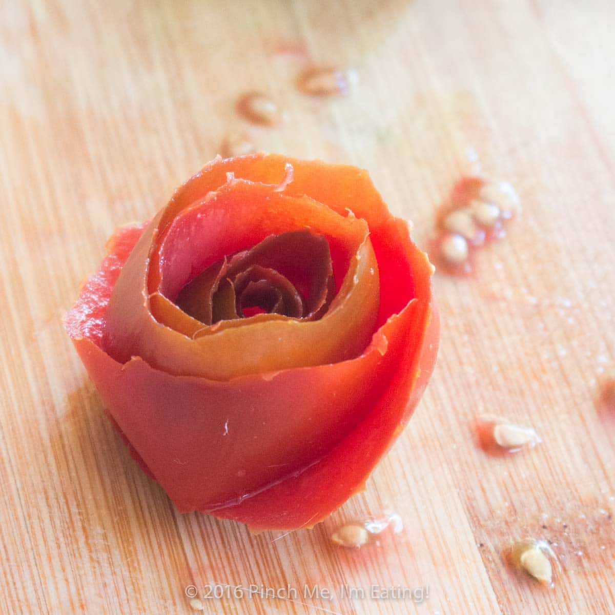 As beautiful as it is delicious, this surprisingly easy smoked salmon, tomato, and avocado rose salad showcases the uninhibited flavors of each ingredient, brightened with a splash of lemon. | www.pinchmeimeating.com