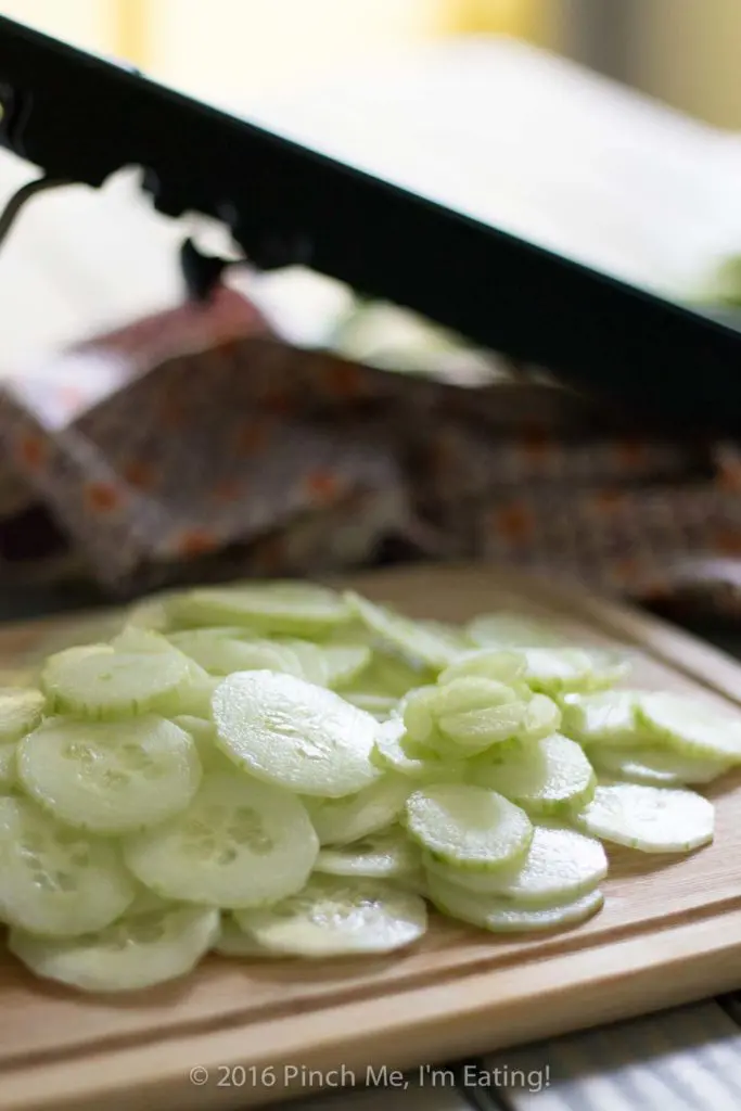 This creamy German cucumber salad, or Gurkensalat, is the perfect companion side dish for bratwurst or burgers. Tangy, sweet, and fresh, it's a deliciously easy summer salad. | www.pinchmeimeating.com