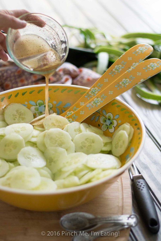 This creamy German cucumber salad, or Gurkensalat, is the perfect companion side dish for bratwurst or burgers. Tangy, sweet, and fresh, it's a deliciously easy summer salad. | www.pinchmeimeating.com