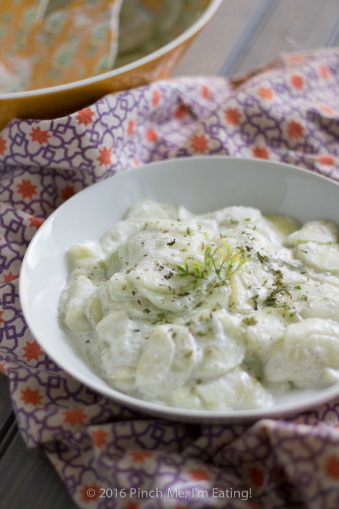 This creamy German cucumber salad, or Gurkensalat, is the perfect companion side dish for bratwurst or burgers. Tangy, sweet, and fresh, it's a deliciously easy summer salad. | www.pinchmeimeating.com