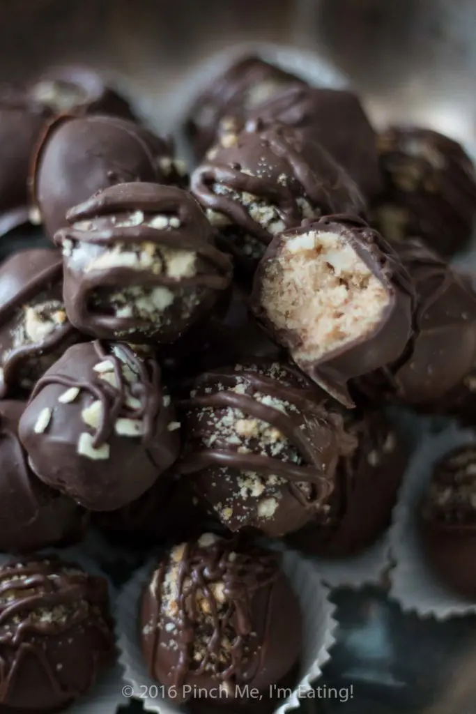 Chocolate covered coconut truffles with Brazil nut or almond butter are a rich, decadent, and easy gourmet dessert perfect for parties (or for treating yourself)! Best of all, you can make this recipe in advance! You can also use cashew butter or macadamia nut butter. | www.pinchmeimeating.com