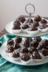 Chocolate covered coconut truffles with Brazil nut or almond butter are a rich, decadent, and easy gourmet dessert perfect for parties (or for treating yourself)! Best of all, you can make this recipe in advance! You can also use cashew butter or macadamia nut butter. | www.pinchmeimeating.com