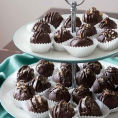 Chocolate covered coconut truffles with Brazil nut or almond butter are a rich, decadent, and easy gourmet dessert perfect for parties (or for treating yourself)! Best of all, you can make this recipe in advance! You can also use cashew butter or macadamia nut butter. | www.pinchmeimeating.com