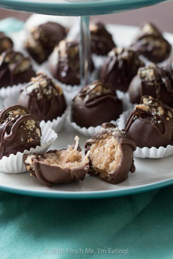 Chocolate covered coconut truffles with Brazil nut or almond butter are a rich, decadent, and easy gourmet dessert perfect for parties (or for treating yourself)! Best of all, you can make this recipe in advance! You can also use cashew butter or macadamia nut butter. | www.pinchmeimeating.com