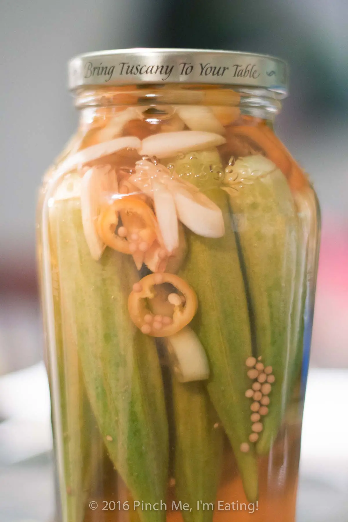 Easy refrigerator pickled okra is perfect for small batches! No canning experience necessary. Make these okra pickles two ways — sweet and tangy or hot and smoky! | www.pinchmeimeating.com