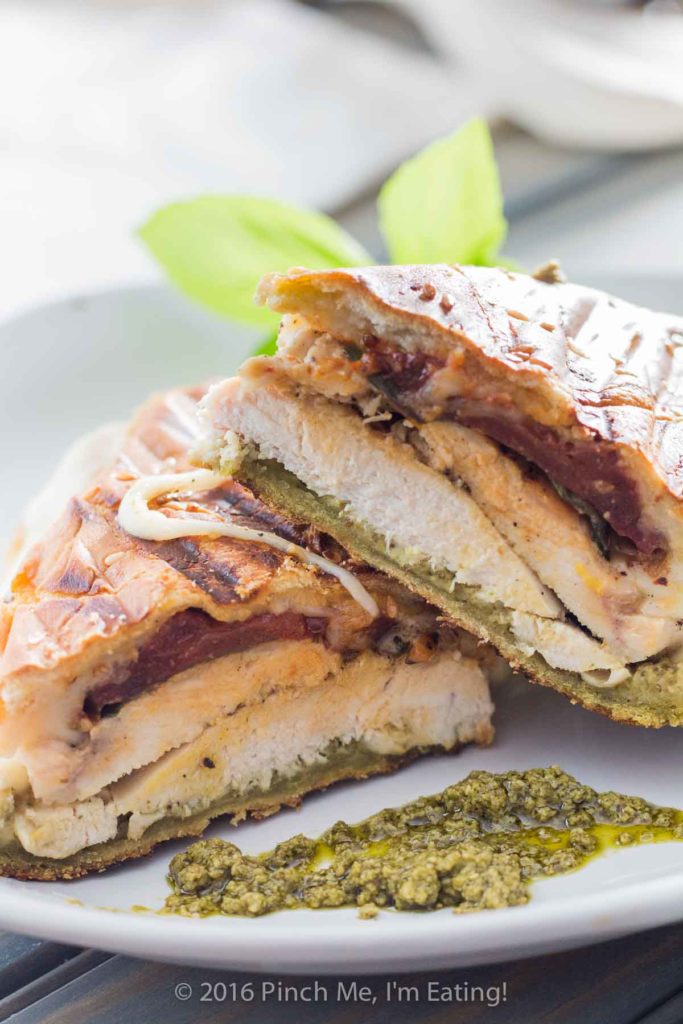 This pesto chicken panini sandwich is crispy on the outside, juicy on the inside, full of flavor, and oozing with melty cheese. Need I say more?