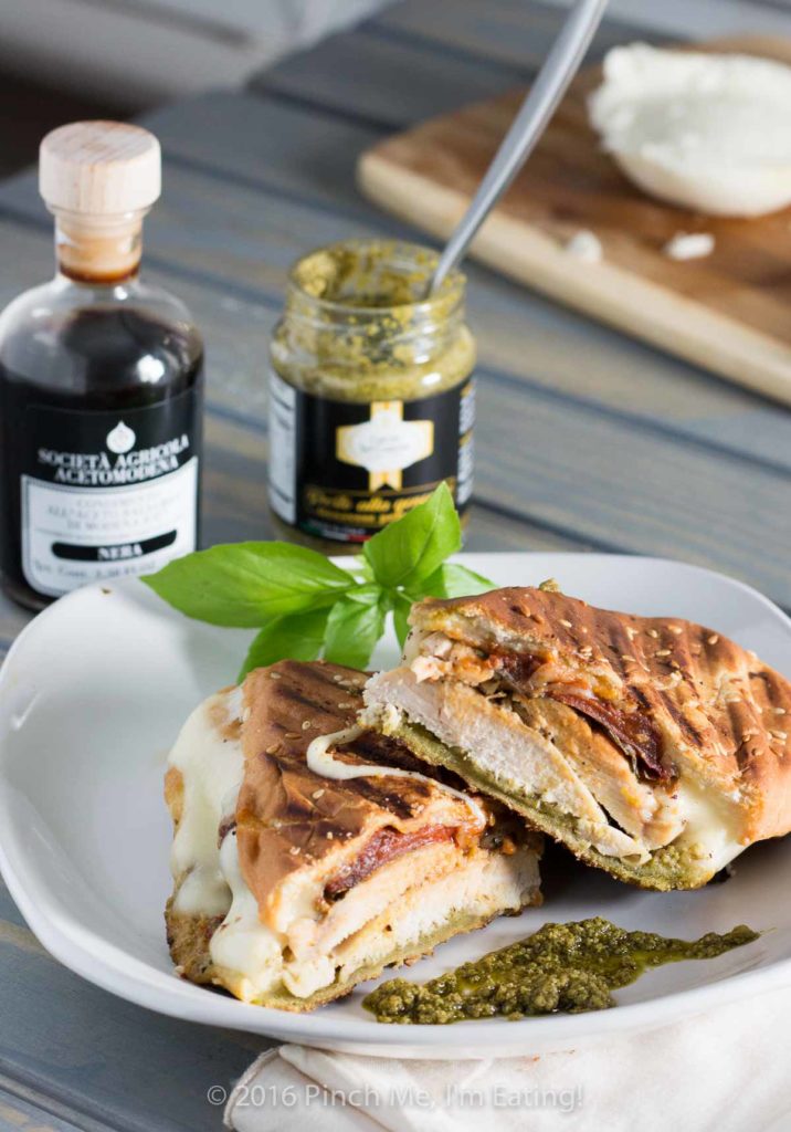 This pesto chicken panini sandwich is crispy on the outside, juicy on the inside, full of flavor, and oozing with melty cheese. Need I say more?