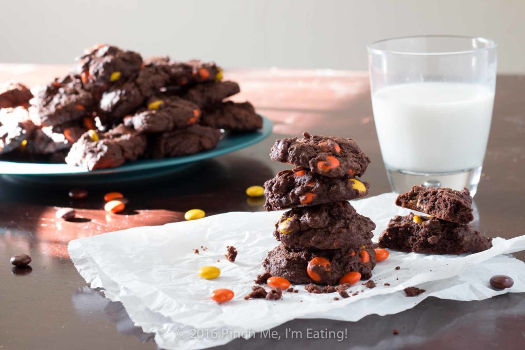 Chocolate Reese's cookies are cakey, brownie-like treats that are packed with peanut butter morsels and stay soft for days! With a rich brown chocolate cookie and orange and yellow Reese's Pieces, these cookies are full of fall colors and are perfect for autumn holidays!