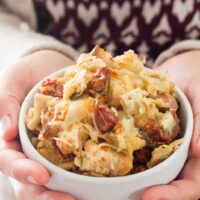 Sourdough sun-dried tomato artichoke stuffing with parmesan is a unique and delicious take on a holiday staple! This recipe is sure to be a crowd-pleaser this Thanksgiving or Christmas! | www.pinchmeimeating.com