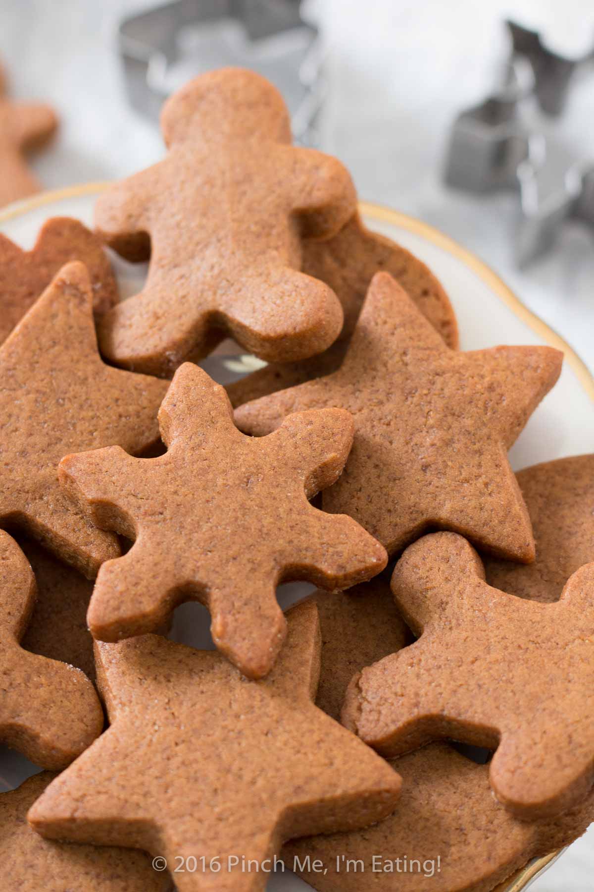 Closeup of chewy gingerbread stars, snowflake, and men arranged on a plate