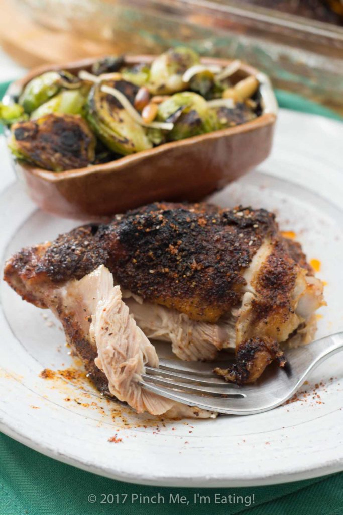 Covered in a delicious and simple sweet and spicy rub, these crispy baked chicken thighs are a satisfying, healthy, and easy main dish perfect for a weeknight dinner.