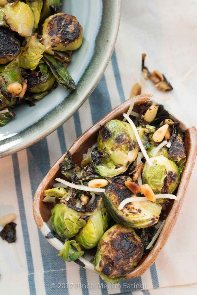 Pan-roasted lemon garlic Parmesan Brussels sprouts with pine nuts are an easy, healthy side dish you can make on the stove in about 15 minutes. 