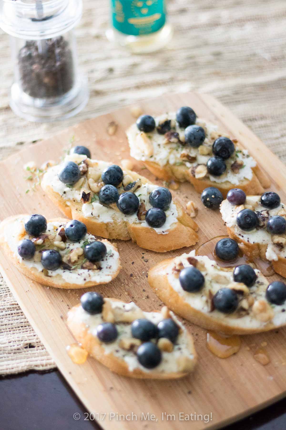 Ricotta Crostini with Blueberries, Walnuts, Thyme, and Honey