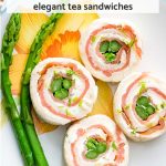 Overhead shot of smoked salmon and asparagus pinwheel tea sandwiches