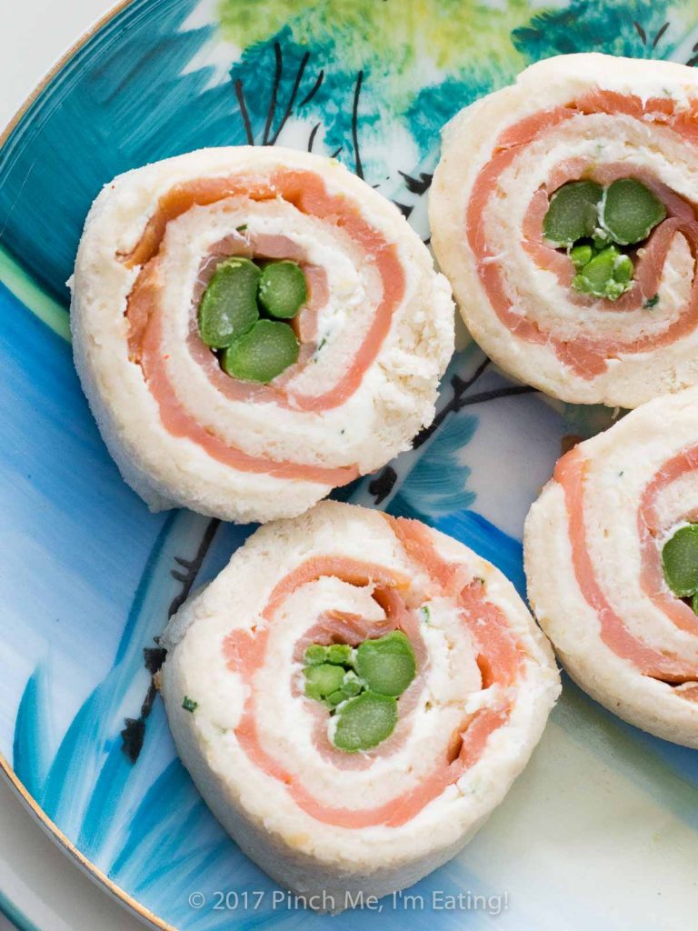 Asparagus and smoked salmon pinwheels with lemon chive cream cheese are the perfect tea sandwiches: beautiful, elegant, and flavorful! They're my favorite finger sandwiches!