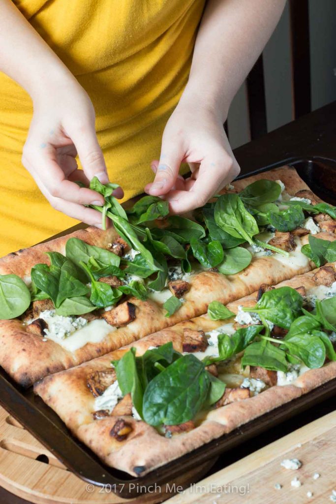 Looking for a unique gourmet pizza? Balsamic chicken pizza with blue cheese and spinach on an olive oil and garlic base might be just the thing! 