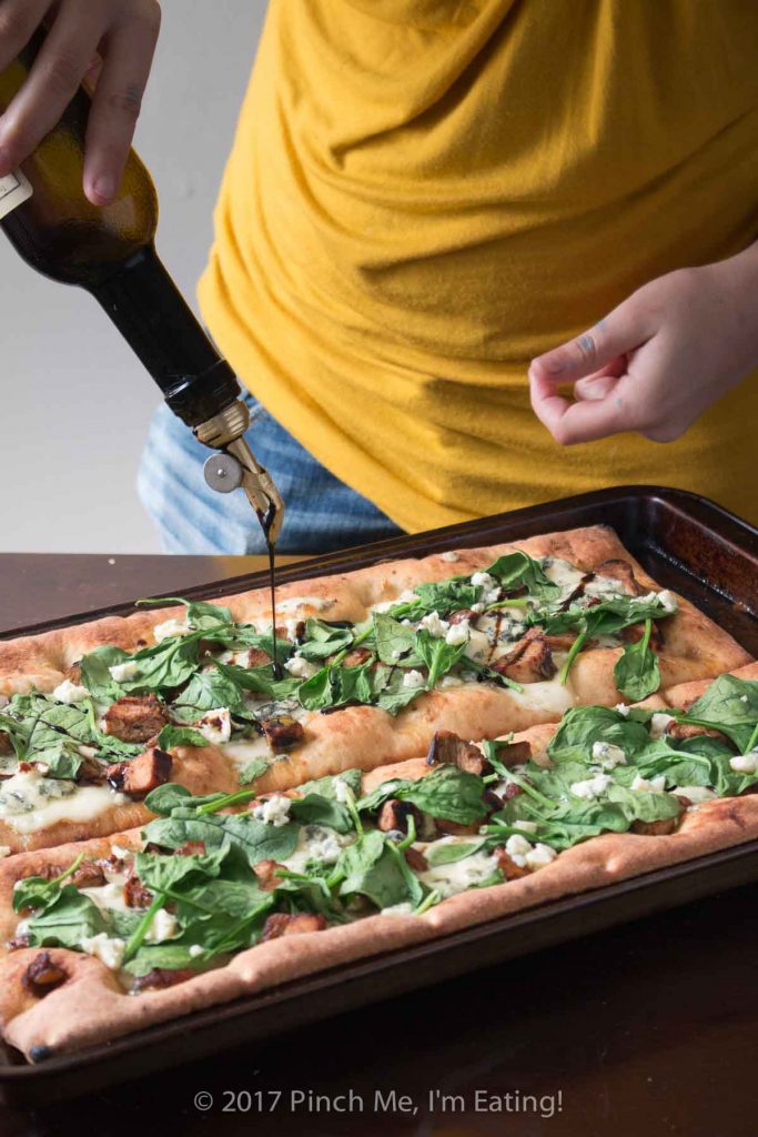 Looking for a unique gourmet pizza? Balsamic chicken pizza with blue cheese and spinach on an olive oil and garlic base might be just the thing! 