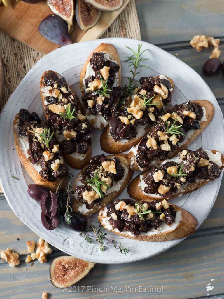 This velvety fig and olive tapenade makes an easy and elegant appetizer for a party or a date night in! You can pre-assemble it with cream cheese and walnuts on crostini or serve it spooned over cheese for guests to spread themselves. 
