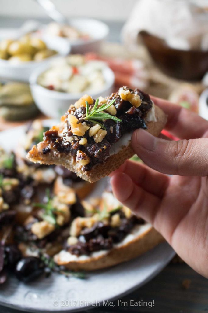 This velvety fig and olive tapenade makes an easy and elegant appetizer for a party or a date night in! You can pre-assemble it with cream cheese and walnuts on crostini or serve it spooned over cheese for guests to spread themselves.