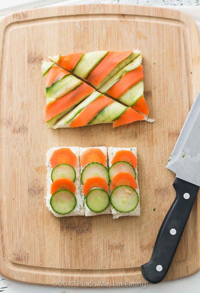 Open-faced marinated carrot and cucumber tea sandwiches with garlic herb butter are a beautiful and colorful twist on the quintessential finger sandwich!