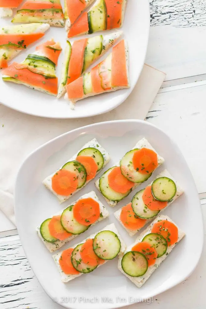 Open-faced marinated carrot and cucumber tea sandwiches with garlic herb butter are a beautiful and colorful twist on the quintessential finger sandwich!