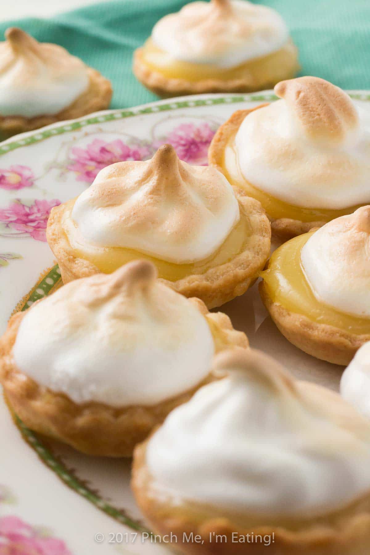 These bite-sized mini lemon meringue pies are a charming and adorable dessert for a springtime or Mother's Day tea party! You can use homemade or store-bought lemon curd. | How to use lemon curd | Mother's Day desserts | Afternoon tea desserts | Afternoon tea recipes