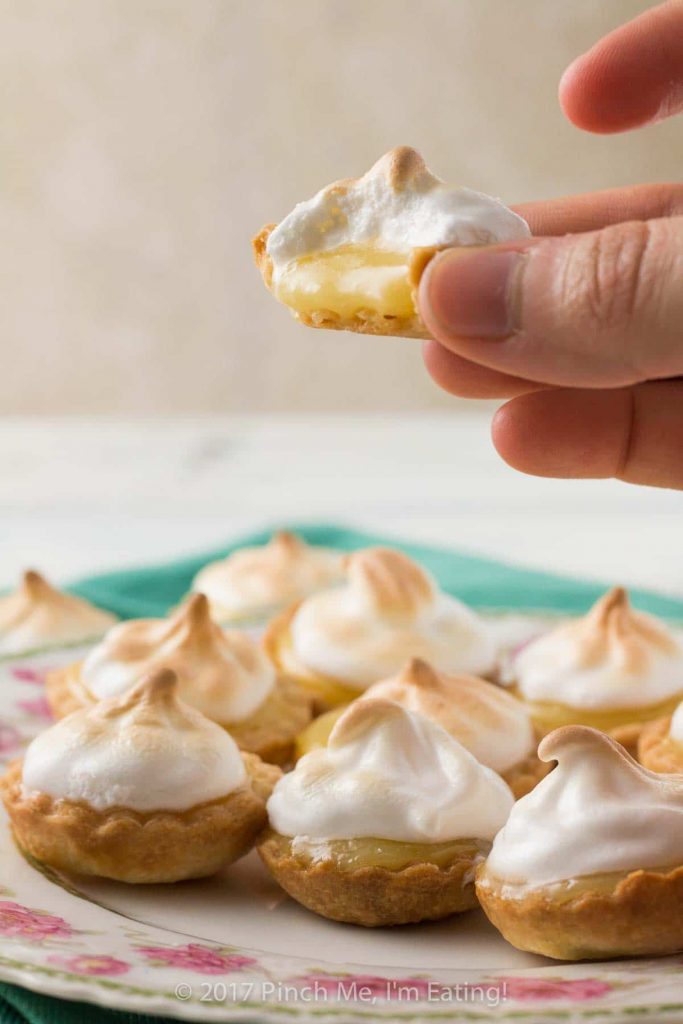 These bite-sized mini lemon meringue pies are a charming and adorable dessert for a springtime or Mother's Day tea party! You can use homemade or store-bought lemon curd. | How to use lemon curd | Mother's Day desserts | Afternoon tea recipes | Afternoon tea desserts