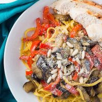 Saffron pasta with eggplant, chicken, bell pepper, and pine nuts may look fancy, but it comes together very easily for a simple weeknight dinner!