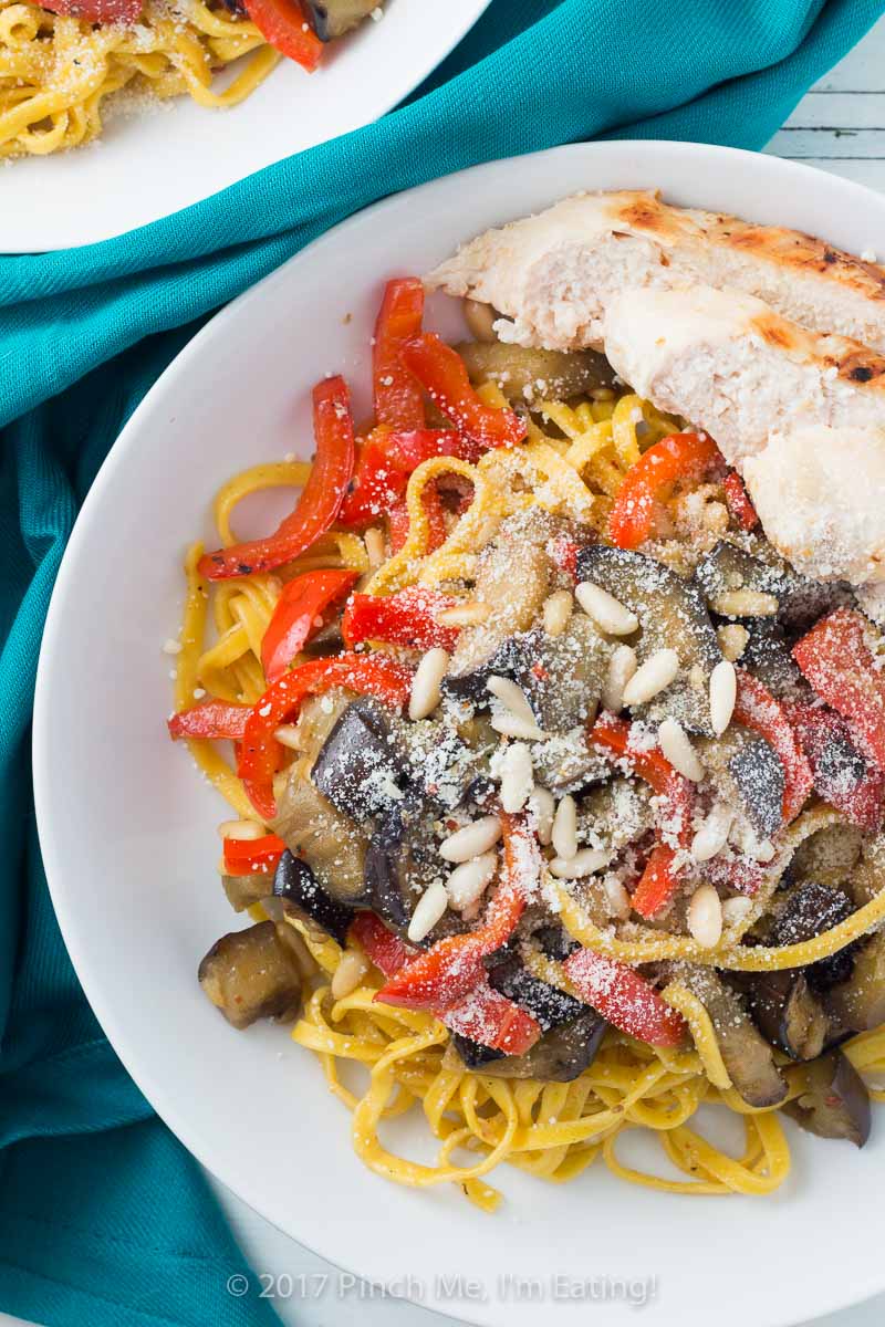 Saffron pasta with eggplant, chicken, bell pepper, and pine nuts may look fancy, but it comes together very easily for a simple weeknight dinner!