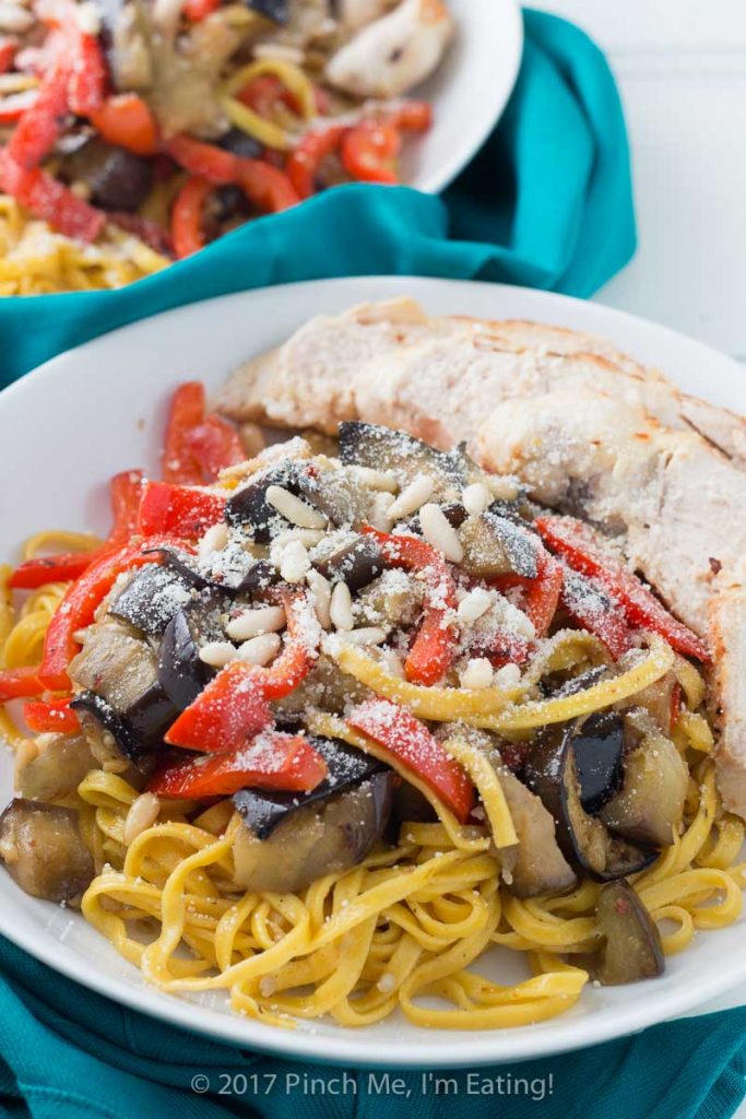 Saffron pasta with eggplant, chicken, bell pepper, and pine nuts may look fancy, but it comes together very easily for a simple weeknight dinner!