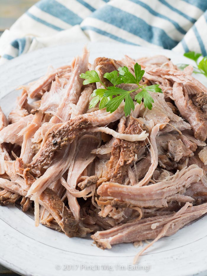 Slow cooker root beer pulled pork is juicy, flavorful, and provides the perfect base for mixing in your favorite barbecue sauce or using in other recipes! Takes only 5 minutes to prep.