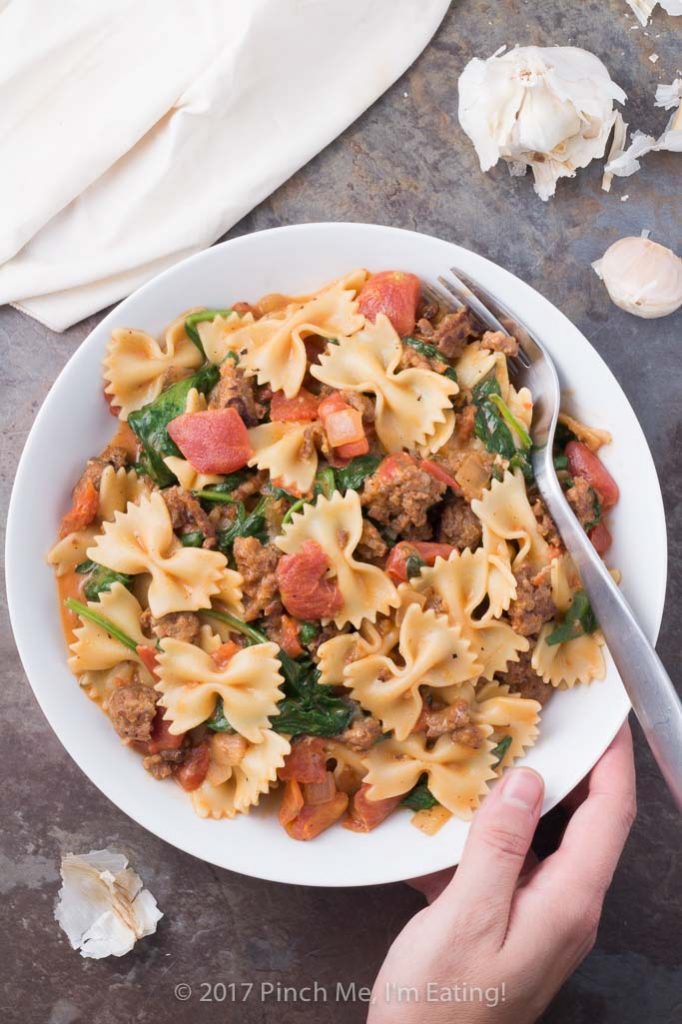 Italian sausage pasta with tomato cream sauce is an easy, cozy weeknight dinner the whole family will love! I like to make a batch of this flavorful comfort food and enjoy the leftovers all week!