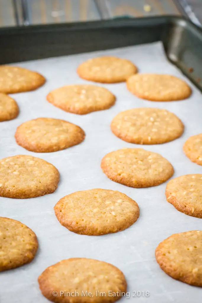 Benne wafers on parchment-lined cookie sheet