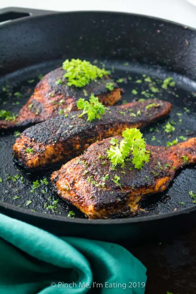 Blackened salmon fillets in cast iron skillet