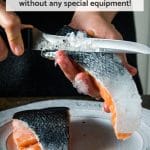 Process shot of descaling salmon fillets